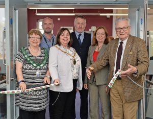 Group of people cutting ribbon of new Bala library