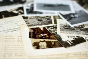 Collection of old photographs and documents on a table