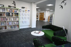 Relaxed seating and book shelves in Llanrwst Library